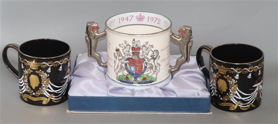 A pair of Wedgwood commemorative ware mugs and a Paragon china mug